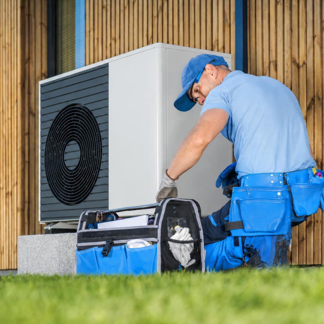 A heat pump being services by an MCS certified engineer