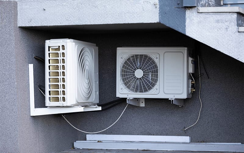 Air source heat pump insatlled under metalic stairs